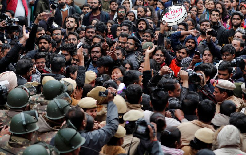 Demonstrators attend a protest against the attacks on students of Jawaharlal Nehru University (JNU) on Sunday, on the university campus in New Delhi