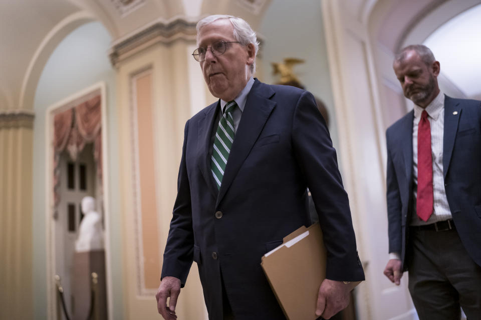 Senate Minority Leader Mitch McConnell, R-Ky., walks to the chamber to begin the work week at the Capitol in Washington, Monday, May 24, 2021. The House has already voted to approve an independent commission to investigate the Jan. 6 U.S. Capitol insurrection but the measure faces an uncertain fate in the evenly divided Senate where Republican leader Mitch McConnell is opposed and former President Donald Trump is demanding the effort be quashed. (AP Photo/J. Scott Applewhite)