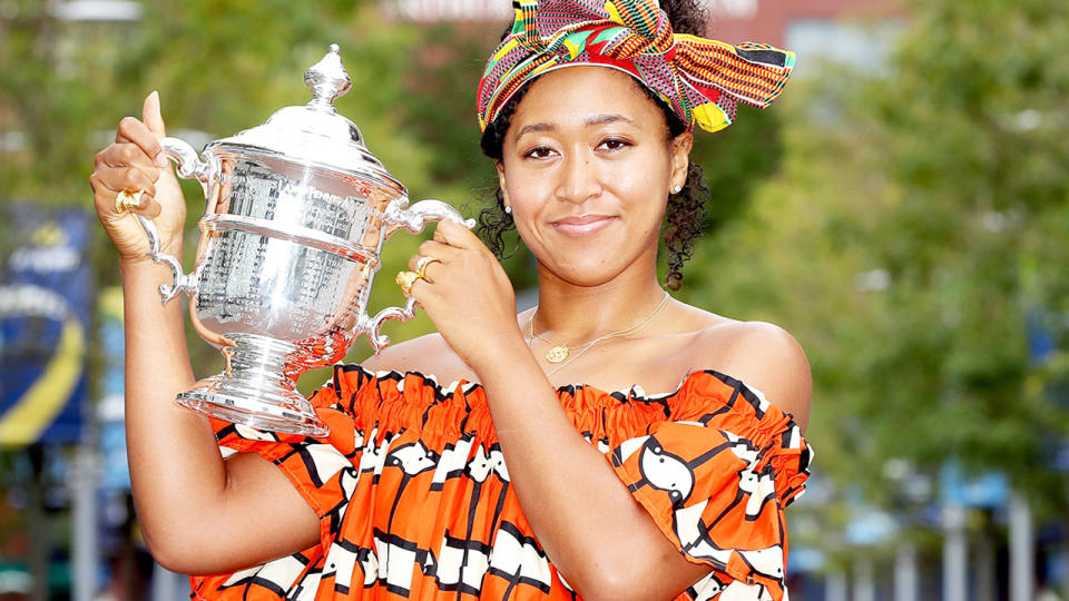 Naomi Osaka, pictured here posing with the US Open trophy.