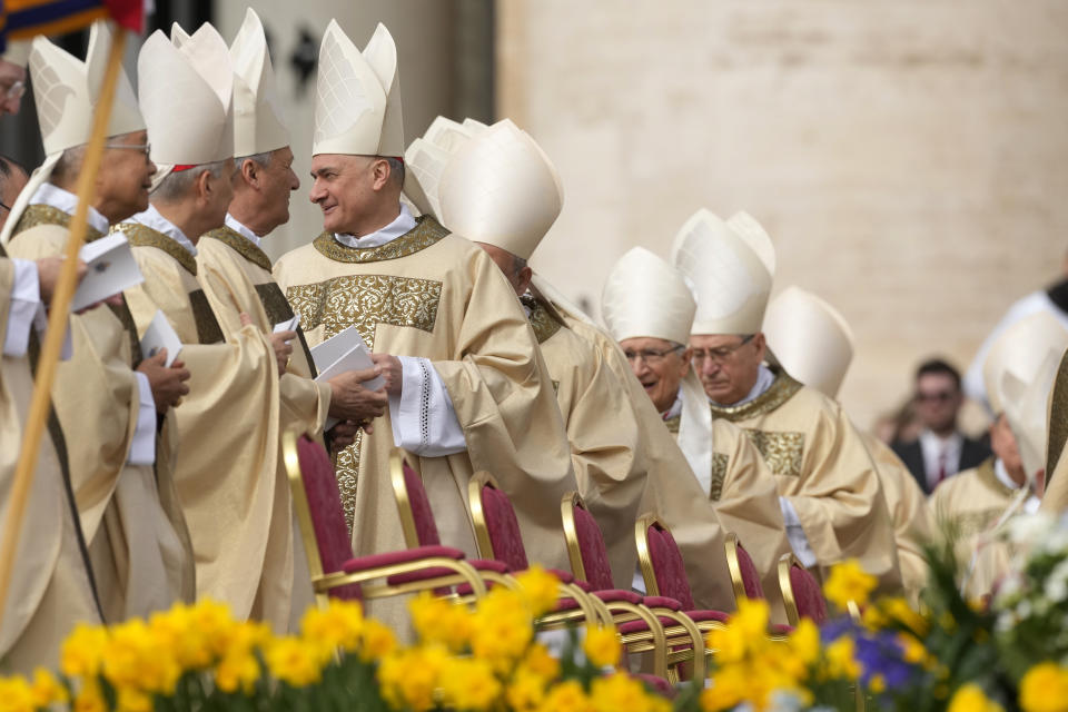 Cardinals arrive in St. Peter's Square at The Vatican where Pope Francis will celebrate the Easter Sunday mass, Sunday, March 31, 2024. (AP Photo/Andrew Medichini)