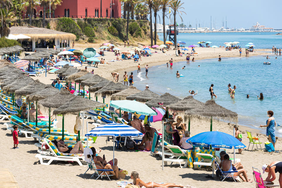 BENALMADENA, SPAIN – JULY 08: People play in the sea as they enjoy the hot weather at the beach on July 8, 2021 in Benalmádena, near Málaga, Spain. AEMET reported that Andalusia will see temperatures between 5-10 degrees Celsius higher than July's average during this weekend. They forecast that Malaga and Almeria will be hit with the highest temperatures. Yesterday Malaga was on Yellow alert for high temperatures due to a local weather phenomenon known as terral winds, hot air that blows from the north toward the coast. The Andalusian Government does not consider adopting more restrictive measures against the Covid-19 pandemic for now because the health situation in the community 'is not concerning' right now. (Photo by David Benito/Getty Images)