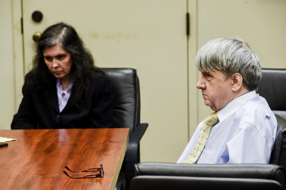 FILE - In this Aug. 3, 2018, file pool photo, defendants David Turpin, right, and wife, Louise, appear in Riverside Superior Court during an information hearing on charges that include torture and child abuse in Riverside, Calif. The couple are accused of mistreating 12 of their 13 children. Jack Osborn, an attorney for seven adult children who were freed from their parents' California home and years of alleged abuse says they are not bitter. Osborn said in an interview aired Wednesday, Jan. 16, 2019, on "Today" that his clients want people to know they are survivors. The Turpins have pleaded not guilty to the charges. (Watchara Phomicinda/The Orange County Register via AP, Pool, File)