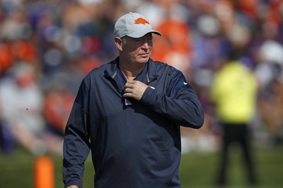 FILE - In this Aug. 4, 2018, file photo, then-Denver Broncos offensive coordinator Bill Musgrave takes part in drills at the team's headquarters during an NFL football training camp in Englewood, Colo. After a pandemic-shortened 2020 season, the California Golden Bears are excited to show off what they hope will be a much more dynamic offense with respected longtime NFL coordinator Bill Musgrave and veteran quarterback Chase Garbers. (AP Photo/David Zalubowski, File)