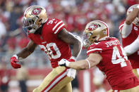 San Francisco 49ers running back Jeff Wilson Jr. (30) celebrates with fullback Kyle Juszczyk (44) after scoring against the Arizona Cardinals during the second half of an NFL football game in Santa Clara, Calif., Sunday, Nov. 17, 2019. (AP Photo/Josie Lepe)