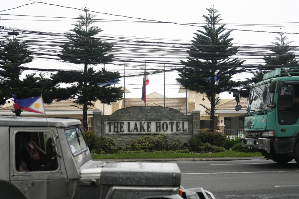 Vehicles pass outside the Lake Hotel in Tagaytay city, south of Manila, Philippines on Thursday, July 11, 2024. Two Australian nationals and a Filipina companion were killed at the Lake Hotel and police efforts were underway to identify and track down suspects, officials said. (AP Photo/Aaron Favila)