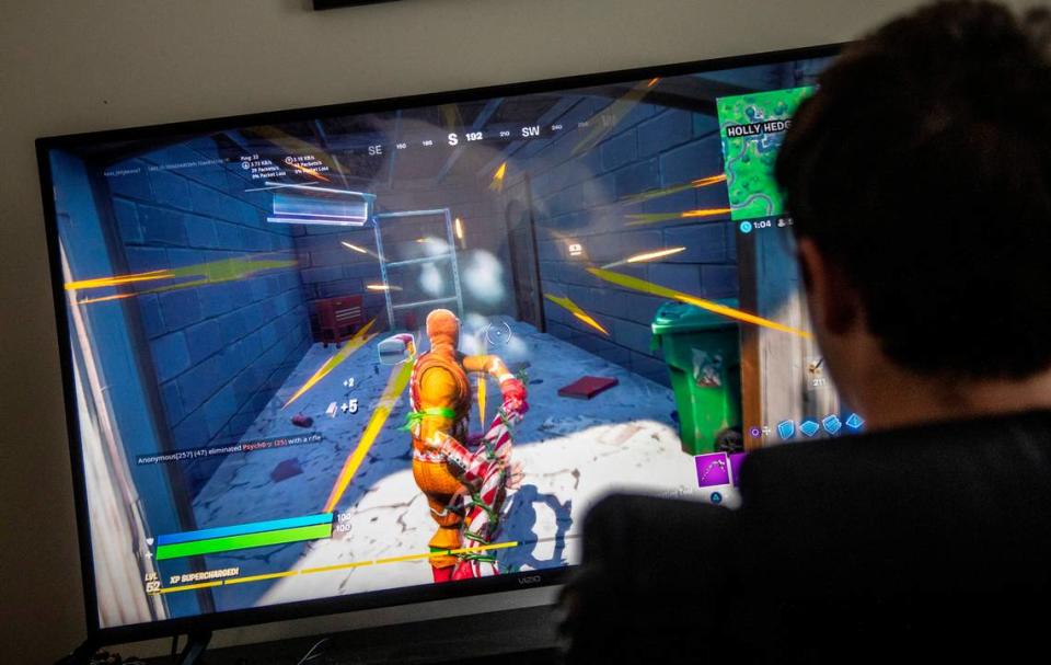 Chase Carson, 15, plays Fortnite on a Playstation 4 gaming console at a friend’s home in Raleigh Wednesday, Sept. 23, 2020.