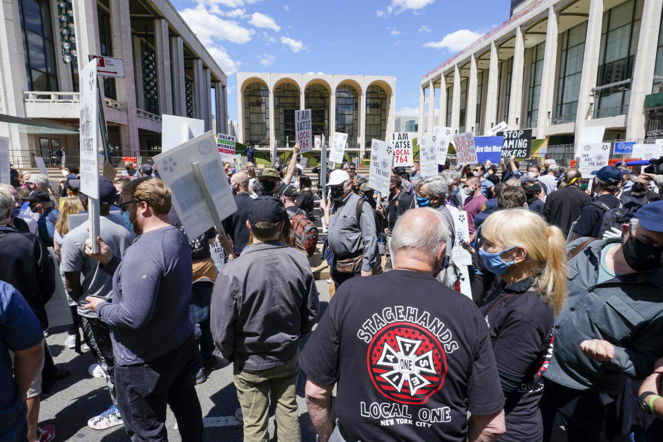 Union member demonstrators rally outside the Metropolitan Opera house during a "We Are the Met Rally," Thursday, May 13, 2021, in New York. Locked out stagehands and unions with contracts expiring this summer demonstrated outside the Met to protest the Opera's unfair treatment of workers, lockout of stagehands and the outsourcing of work. (AP Photo/Mary Altaffer)