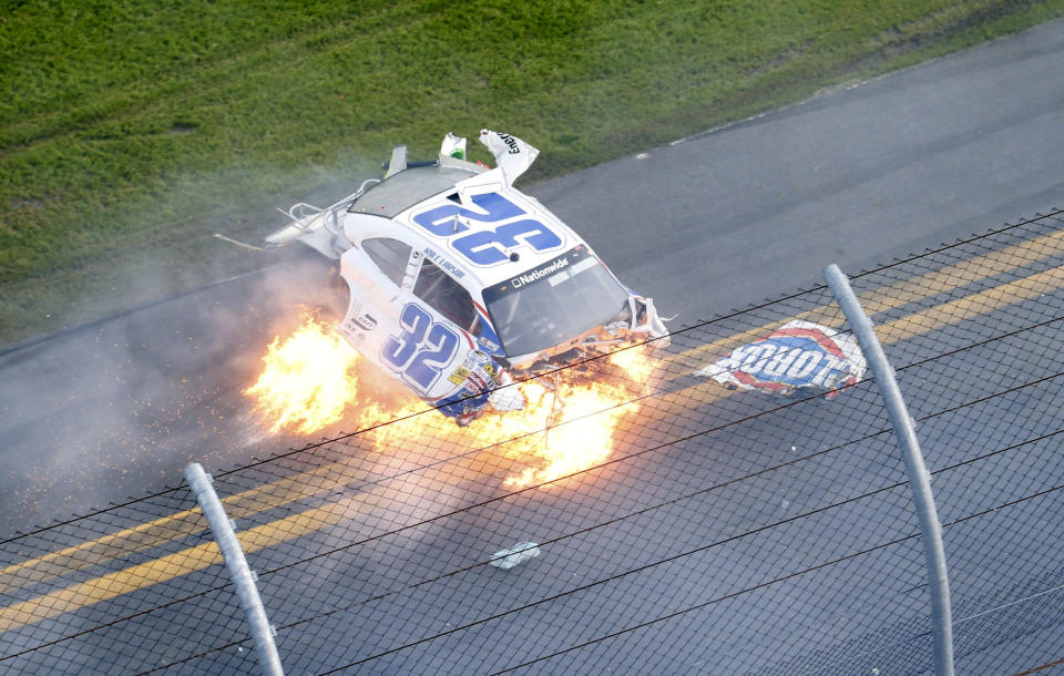 NASCAR driver Kyle Larson's Chevrolet slides on fire down the front stretch on the final lap during the NASCAR Nationwide Series DRIVE4COPD 300 race at the Daytona International Speedway in Daytona Beach, Florida February 23, 2013. The Daytona 500 NASCAR Sprint Cup race is scheduled for February 24. REUTERS/Pierre Ducharme (UNITED STATES - Tags: SPORT MOTORSPORT TPX IMAGES OF THE DAY) - RTR3E6QU