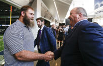 New Dallas Cowboys head coach Mike McCarthy, right, greets player Travis Frederick after a press conference at the Dallas Cowboys headquarters Wednesday, Jan. 8, 2020, in Frisco, Texas. (AP Photo/Brandon Wade)