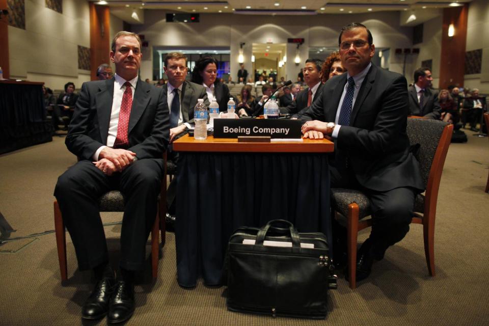 Boeing Commercial Airplanes Vice President and Chief Project Engineer Mike Sinnett, left, seats with unidentified Boeing officials during a hearing investigating a battery fire aboard a Boeing 787, Tuesday, April 23, 2013, at the National Transportation Safety Board (NTSB) in Washington. (AP Photo/Charles Dharapak)