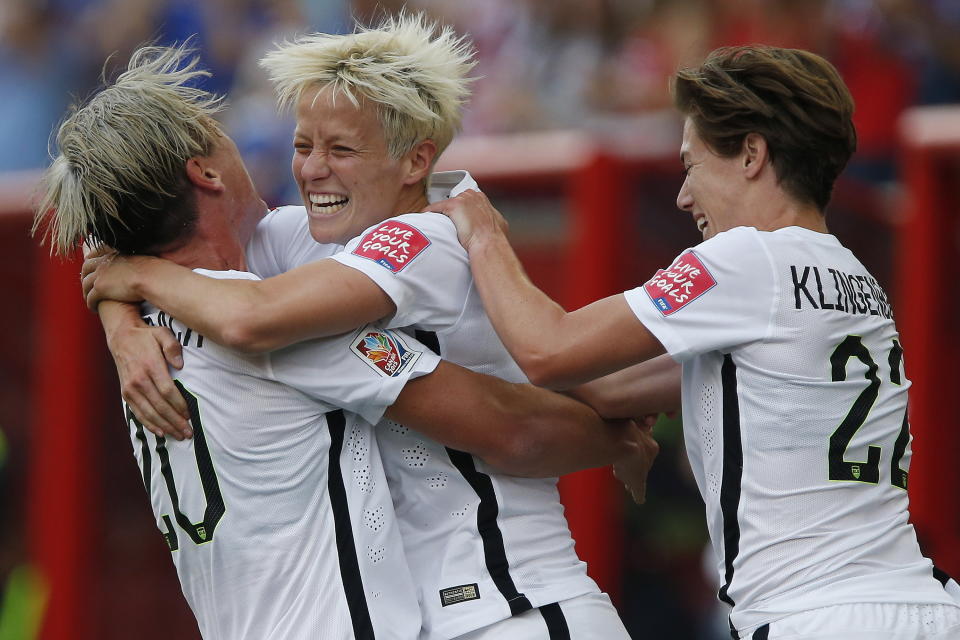 FILE - United States' Megan Rapinoe, center, Abby Wambach (20) and Meghan Klingenberg (22) celebrate Rapinoe's goal against Australia during a FIFA Women's World Cup soccer match in Winnipeg, Manitoba, Monday, June 8, 2015. On Sunday, Sept. 24, 2023, Rapinoe will play her final game in a U.S. jersey when the United States faces South Africa at Chicago's Soldier Field. (John Woods/The Canadian Press via AP, File)