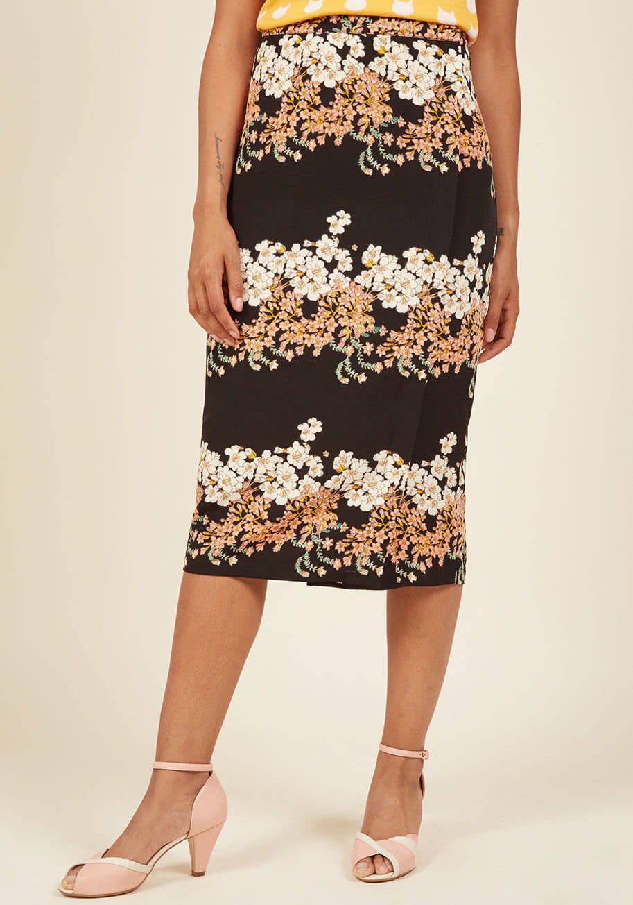 Shop it <strong><a href="https://www.modcloth.com/shop/sale-bottoms/meeting-medley-pencil-skirt-in-floral-black/153171.html?dwvar_153171_color=BLK&amp;cgid=" target="_blank">here</a></strong>.