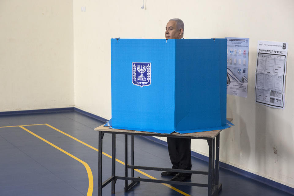 Israeli Prime Minister Benjamin prepares to vote at a voting station in Jerusalem on September 17, 2019. Israelis began voting Tuesday in an unprecedented repeat election that will decide whether longtime Prime Minister Benjamin Netanyahu stays in power despite a looming indictment on corruption charges. (Heidi Levine, Sipa, Pool via AP).