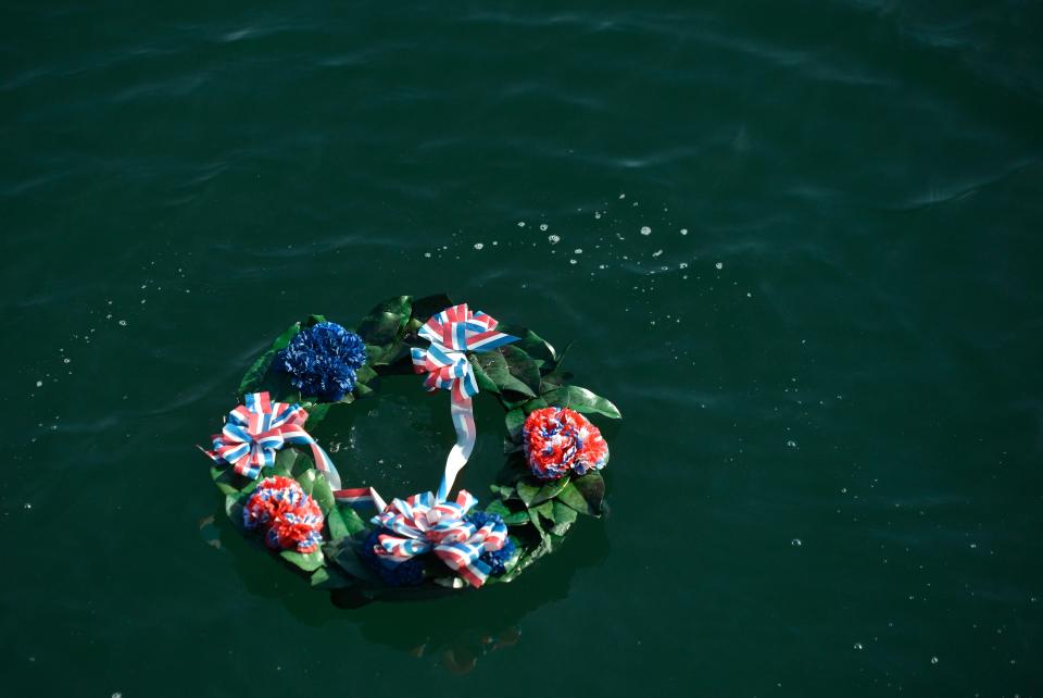 A memorial wreath was cast off MacMillan Pier in honor of those who served in the seagoing services during a Veterans Day Ceremony in 2021.