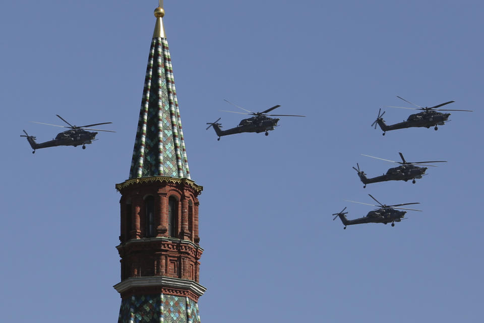 Russian Air Force Mi-28 helicopters fly over Red Square during a Victory Day parade, which commemorates the 1945 defeat of Nazi Germany, in Moscow, Russia, Friday, May 9, 2014. Russia marked the Victory Day on May 9 holding a military parade at Red Square. (AP Photo/Denis Tyrin)