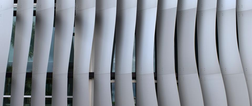 The Kotler|Coville Glass Pavilion’s aluminum fins keep the sun off the art glass on display in the pavilion, yet allow natural light into the space.