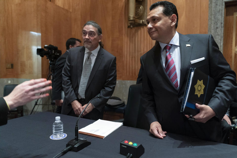 Census Bureau Director nominee Robert Santos, left, and nominee for Assistant Secretary of Homeland Security, Ed Gonzalez, of Texas, listen to instructions as they arrive for a Senate Homeland Security and Governmental Affairs committee hearing on their nominations, Thursday, July 15, 2021, on Capitol Hill in Washington. If confirmed, Santos, a third-generation Mexican American, would be the first person of color to be a permanent head of the nation's largest statistical agency. (AP Photo/Jacquelyn Martin)