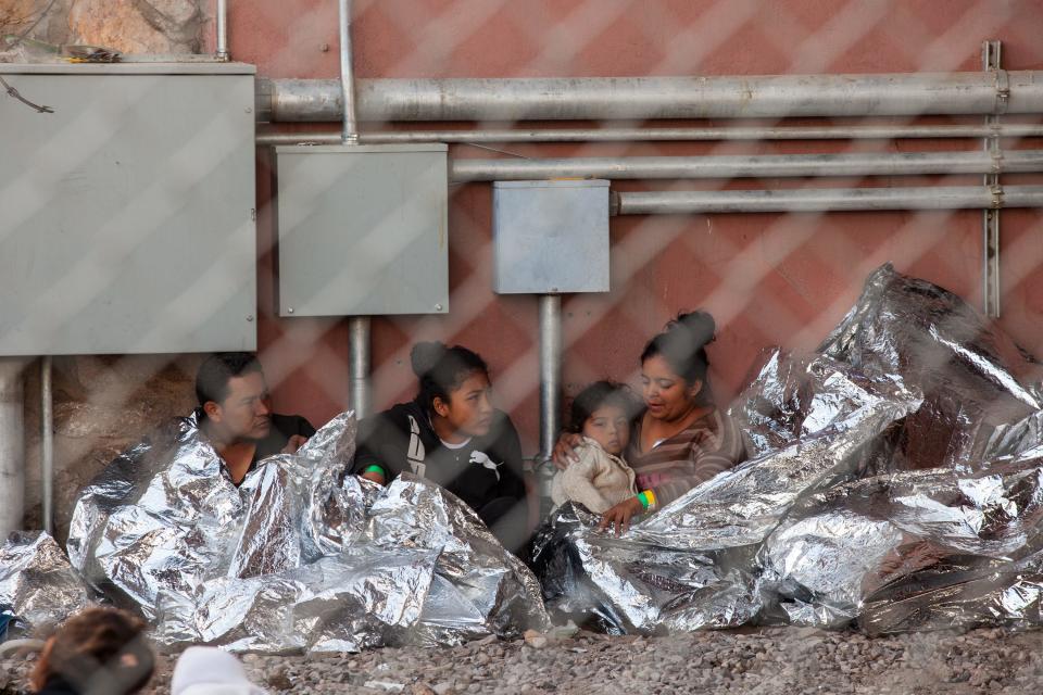 Migrants held in temporary fencing underneath the Paso Del Norte Bridge await processing on March 28, 2019 in El Paso, Texas. U.S. Customs and Border Protection has temporarily closed all highway checkpoints along the 268-mile stretch of border in the El Paso sector to try to stem a surge in illegal entry.  (Photo by Christ Chavez/Getty Images)