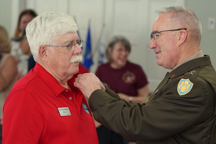 Lady Lake Mayor Ed Freeman received the award from Gen. Edward Chrystal.