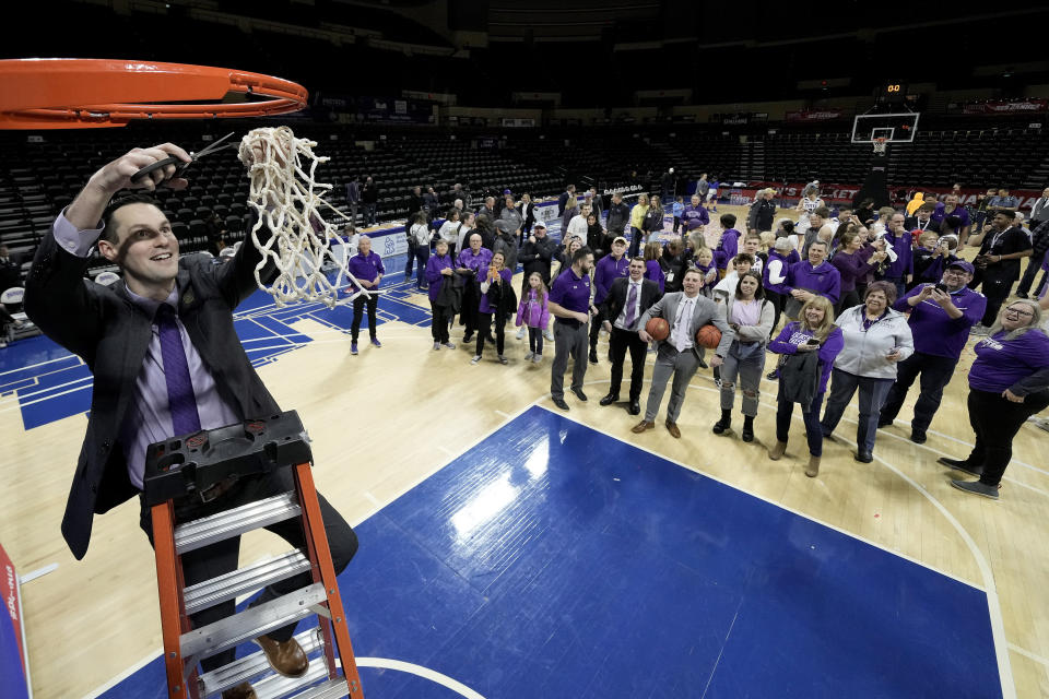 College of Idaho head coach Colby Blaine celebrate after the NAIA men's national championship college basketball game against Indiana Tech Saturday, March 18, 2023, in Kansas City, Mo. College of Idaho won 73-71. (AP Photo/Charlie Riedel)