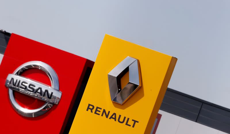 FILE PHOTO: The logos of car manufacturers Renault and Nissan are seen in front of dealerships of the companies in Reims