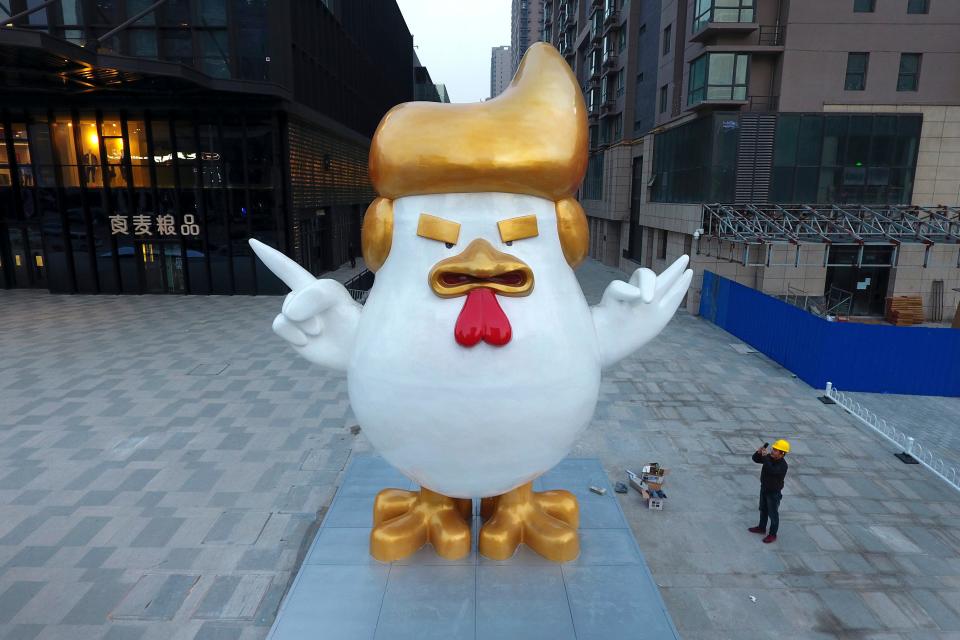 Giant rooster sculpture resembling U.S. President-elect Donald Trump on display Dec. 29, 2016, outside a shopping mall in China to celebrate the upcoming Chinese Year of the Rooster.