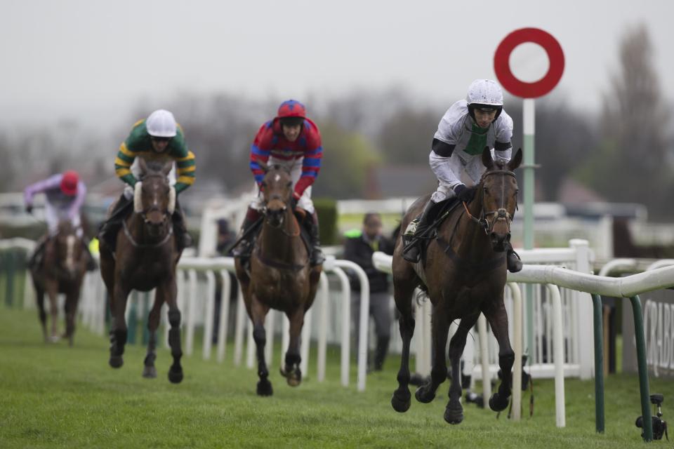 Pineau De Re ridden by Leighton Aspell, right, wins the Grand National horse race at Aintree Racecourse Liverpool, England, Saturday, April 5, 2014. (AP Photo/Jon Super)