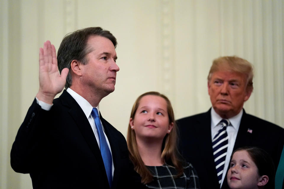 Kavanaugh takes his oath during his ceremonial swearing-in as a Supreme Court justice in October as Trump and Kavanaugh's daughters Liza and Margaret look on. (Photo: Jonathan Ernst / Reuters)