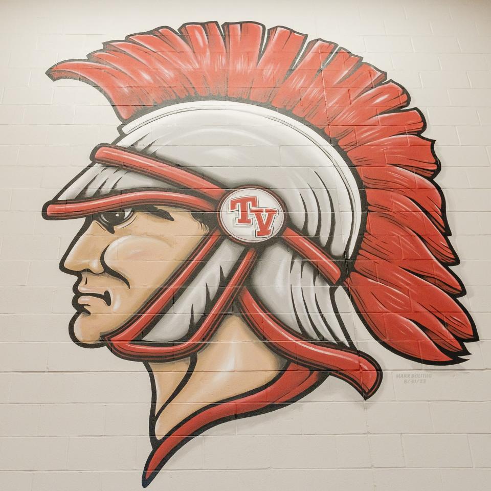 A Trojan head painted by Mark Bolitho greets students as they walk in the doors to the new Tusky Valley Middle-High School.