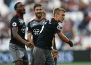 Britain Football Soccer - West Ham United v Southampton - Premier League - London Stadium - 25/9/16 Southampton's James Ward-Prowse celebrates scoring their third goal with team mates Reuters / Eddie Keogh Livepic