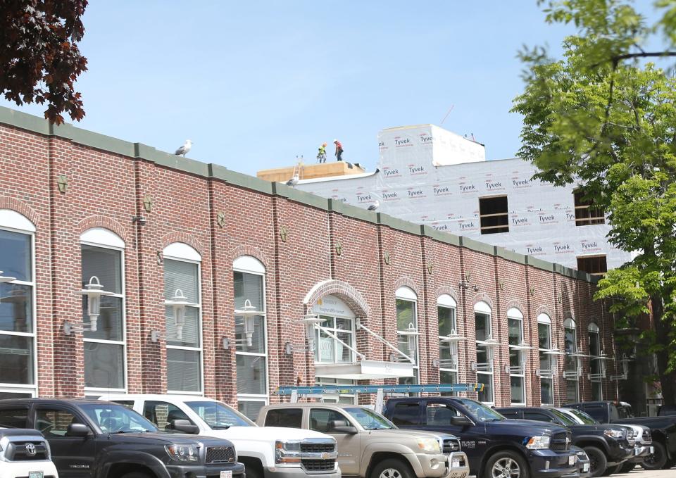 The building at 361 Hanover St. was the former Heinemann Publishing building and once was the home of Portsmouth Steam Factory and is in the foreground of large scale buildings seen on Deer Street.