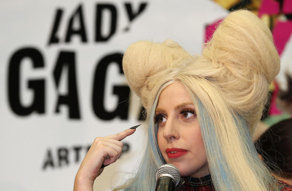Lady Gaga speaks during a press conference to promote her album "ARTPOP" in Tokyo, Sunday, Dec. 1, 2013. (AP Photo/Shizuo Kambayashi)