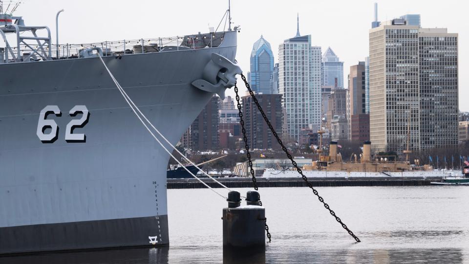 The Philadelphia skyline is visible behind the Battleship New Jersey Museum and Memorial located on the Camden Waterfront.