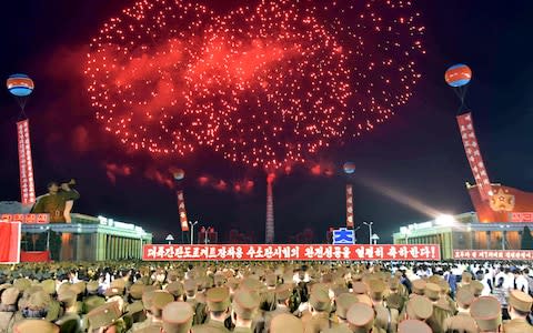 Pyongyang city civilians celebrate the successful completion of the hydrostatic test for the intercontinental ballistic rocket installation in a photo released on Wednesday by North Korea's Korean Central News Agency - Credit: Reuters