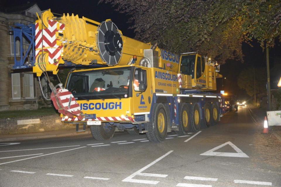 Wiltshire Times: The specialist 130-tonne crane brought in to Bradford on Avon for the removal operation prepares to leave after the scheduled work was called off. Photo: Trevor Porter 69863-3