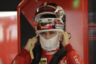 Ferrari driver Charles Leclerc of Monaco wears the helmet during the second free practice at the Yas Marina racetrack in Abu Dhabi, United Arab Emirates, Friday, Nov. 29, 2019. The Emirates Formula One Grand Prix will take place on Sunday. (AP Photo/Luca Bruno)