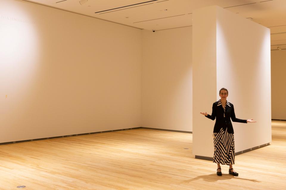 Lauren Lessing, director of the Stanley Museum of Art, speaks in one of the new galleries Tuesday. Lessing provided a sneak peek of the new building to members of the media.