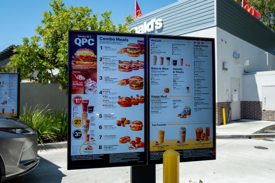 Computer screen with menu, building, McDonald's logo and the front of a vehicle are seen at the McDonald's drive-thru in San Ramon, California, August 3, 2024. (Photo by Smith Collection/Gado/Getty Images)