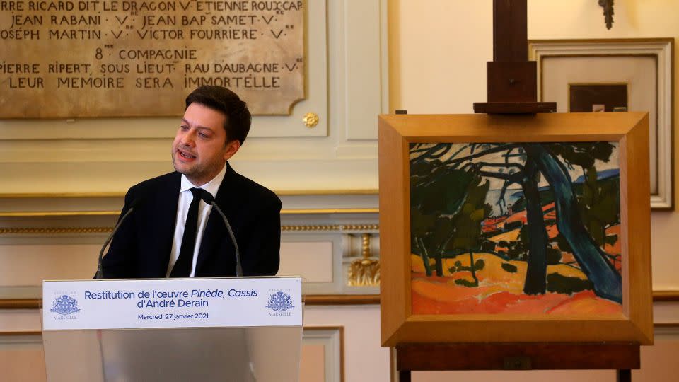 Marseille's mayor Benoit Payan gives a speech next to an André Derain painting titled ''Pinede, Cassis'' in January 2021 during a ceremony to return it to the family of René Gimpel. - Alain Robert/SIPA/AP