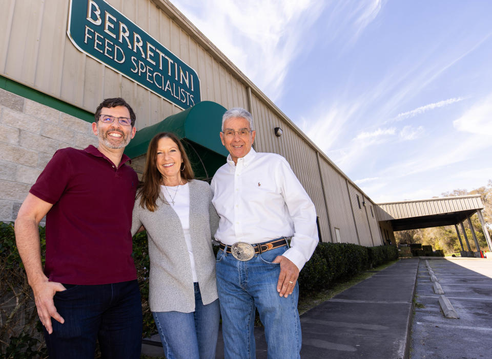 General Manager Michael Berrettini, left; his mother and VP Jan Berrettini, center, and Jan's husband, Angelo Berrettini, right, stand outside the Berrettini Feed Specialists building on Feb. 28. The business is celebrating its 50th anniversary this year.