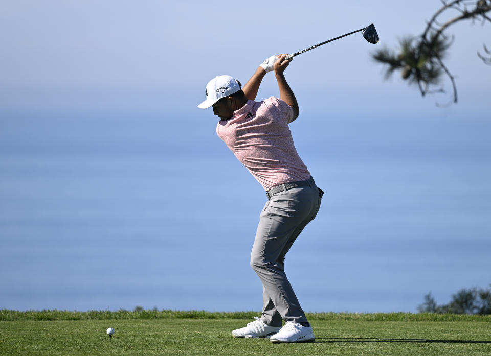 Xander Schauffele hits his tee shot on the 11th hole of the North Course at Torrey Pines during the first round of the Farmers Insurance Open golf tournament, Wednesday, Jan. 26, 2022, in San Diego. (AP Photo/Denis Poroy)