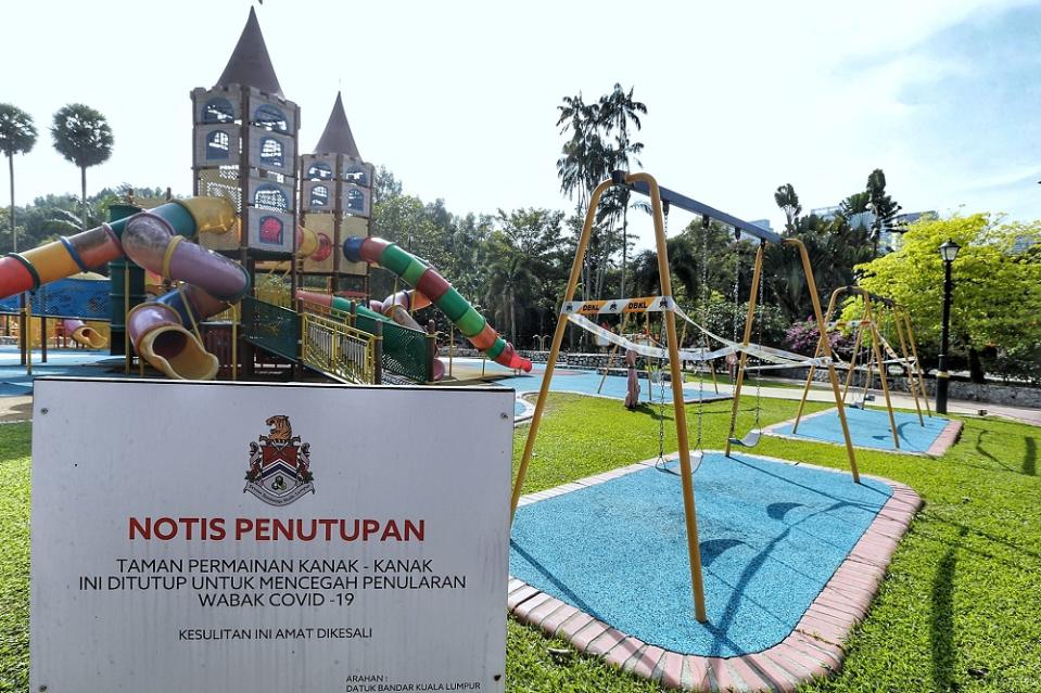 A closure notice is seen at the playground area of Taman Botani Perdana in Kuala Lumpur October 19, 2020.