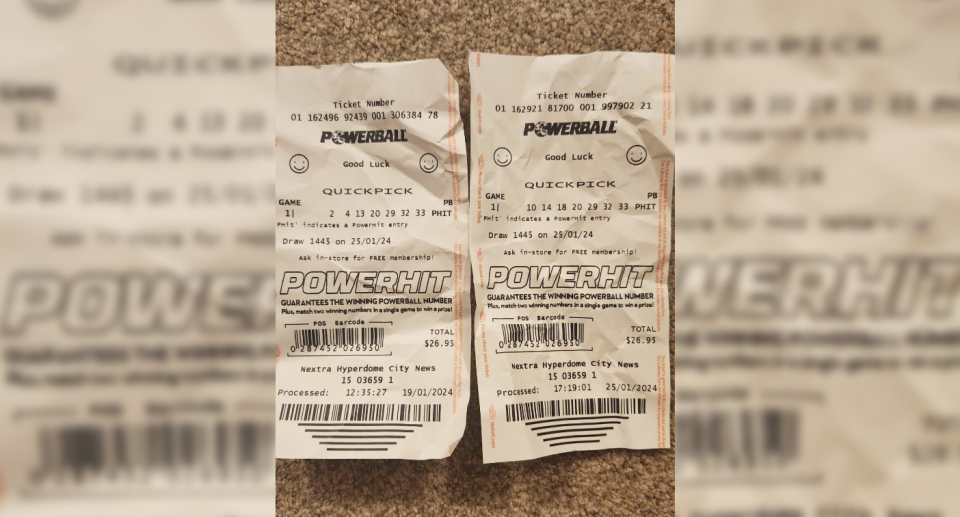 The Powerball tickets placed side-by-side showing 20, 29, 32 and 33 had been selected for both.