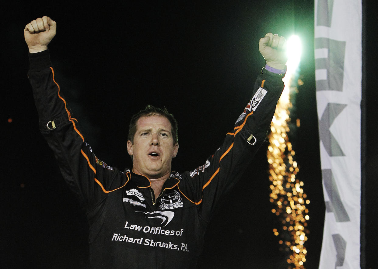 FORT WORTH, TX – SEPTEMBER 15: Jason Johnson celebrates after winning a dirt track race in Texas in 2012. (Brandon Wade/Getty Images for Texas Motor Speedway)