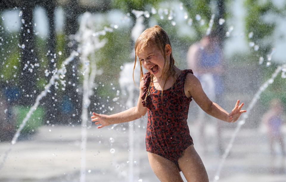 Eleanor Nicely plays at the splash pad at Switchyard Park on Wednesday, June 15, 2022.