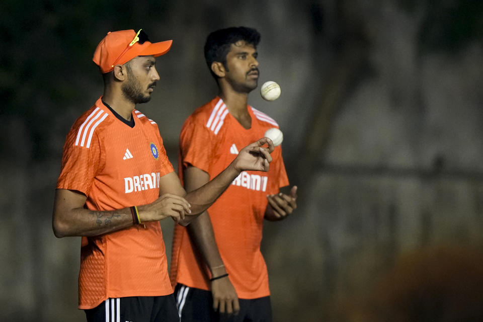 India's cricketers Axer Patel and Washington Sunder attend a training session on the eve of the first T20 cricket match between India and Australia in Visakhapatnam, India, Wednesday, Nov. 22, 2023. (AP Photo/Mahesh Kumar A.)