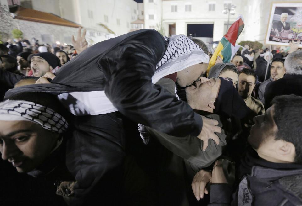 A prisoner released from an Israeli prison is welcomed by relatives in the West Bank city of Ramallah