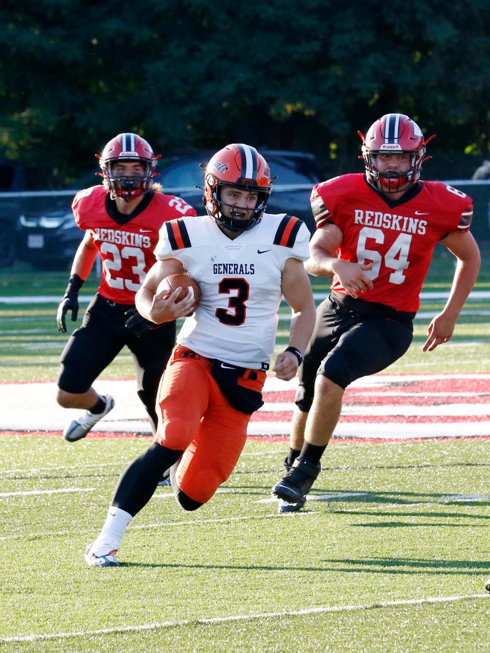 Ridgewood quarterback Carter Fry runs with the ball against Coshocton on Friday night at Stewart Field.