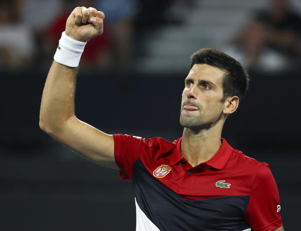 Novak Djokovic of Serbia reacts after winning the first set during his match against Kevin Anderson of South Africa at the ATP Cup tennis tournament in Brisbane, Australia, Saturday, Jan. 4, 2020. (AP Photo/Tertius Pickard)