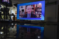 A screen shows Anthony S. Fauci, Director of the National Institute of Allergy and Infectious Diseases (NIAID) at the U.S.A., during a remotely panel titled "COVID 19: What's Next?" at the Davos Agenda 2022, in Cologny near Geneva, Switzerland, Monday, Jan. 17, 2022. The Davos Agenda, which takes place from Jan. 17 to Jan. 21, 2022, is an online edition of the annual Davos meeting of the World Economy Forum due to the coronavirus pandemic. (Salvatore Di Nolfi/Keystone via AP)